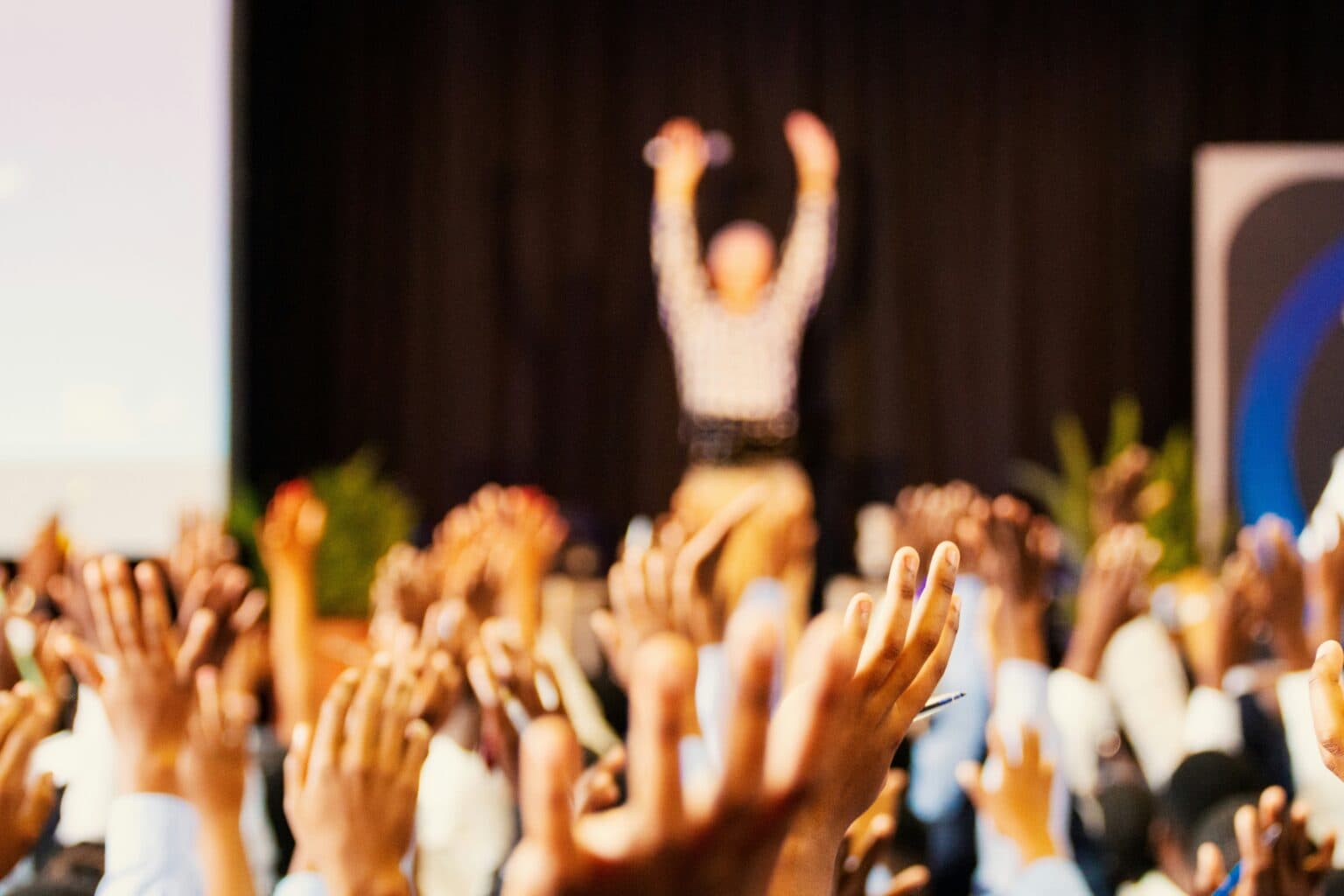 An audience taking part in a conference